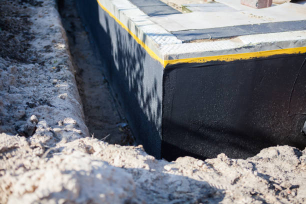 Professional Emergency Waterproofing technician working in Hillsdale, MI
